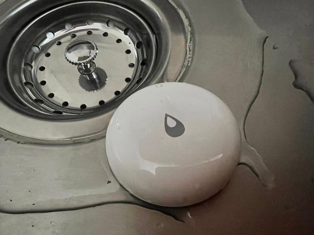 Picture of a water leak sensor in a wet sink.